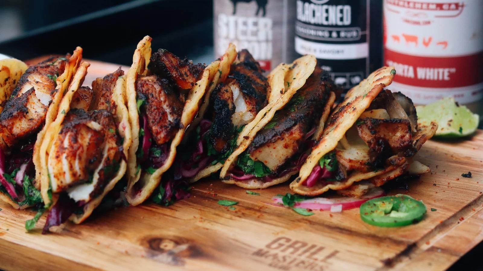 Sweet & Smoky Fish Tacos topped with crushed Sweet & Smokey Pepper Mitten Chips
