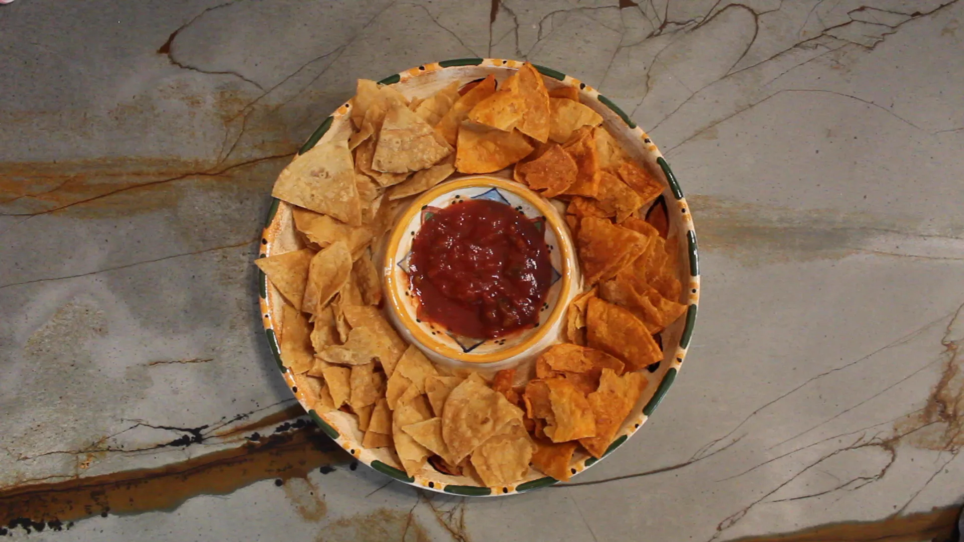 Platter of Traditional and Sweet & Smokey Pepper Mitten Chips around a bowl of salsa